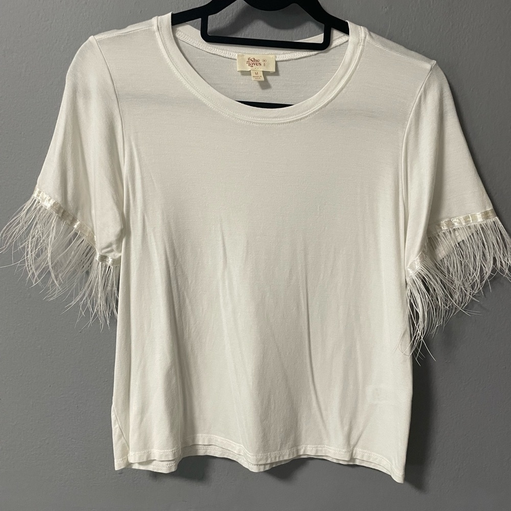 If She Loves ostrich trim short sleeves white shirt. Size Medium